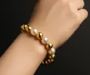 Pulsera bolitas con perla ajustable