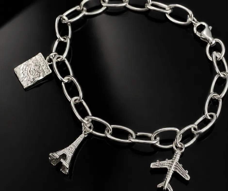 [ART-0001] Pulsera de viajes 20 cm (3 dijes Avión, Torre Eiffel, y pasaporte)